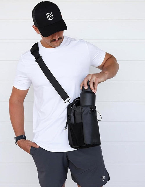 Load image into Gallery viewer, Magnetic Sling Bag for Men &amp; Women. Ideal as a gym, travel, and work bag. Keeps your belongings off the dirty gym floor.
