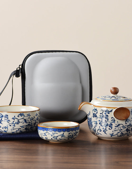Load image into Gallery viewer, Blue and white beige Ru kiln travel tea set one pot three cups outdoor portable entwined lotus ceramic retro teapot
