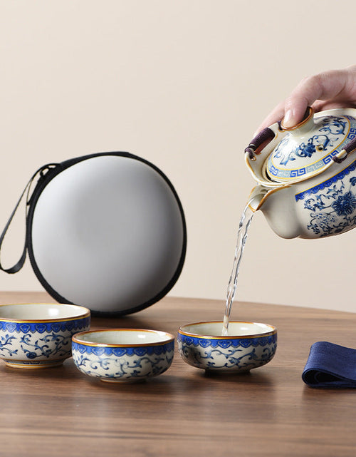 Load image into Gallery viewer, Blue and white beige Ru kiln travel tea set one pot three cups outdoor portable entwined lotus ceramic retro teapot
