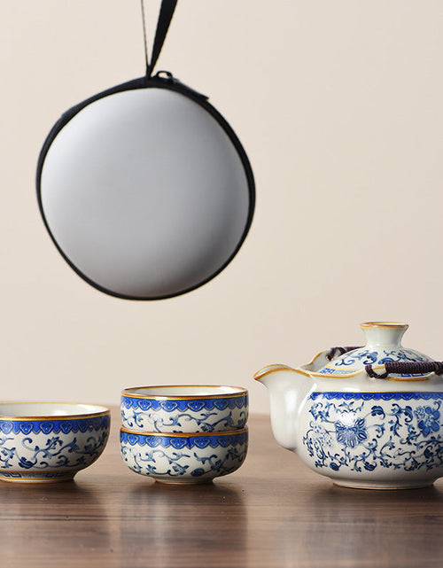 Load image into Gallery viewer, Blue and white beige Ru kiln travel tea set one pot three cups outdoor portable entwined lotus ceramic retro teapot
