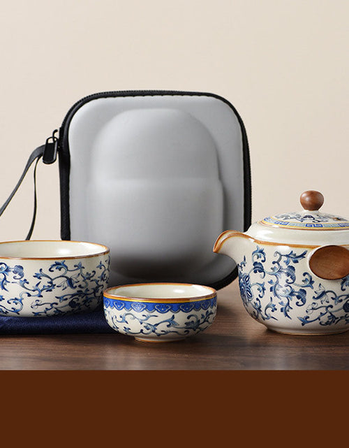 Load image into Gallery viewer, Blue and white beige Ru kiln travel tea set one pot three cups outdoor portable entwined lotus ceramic retro teapot
