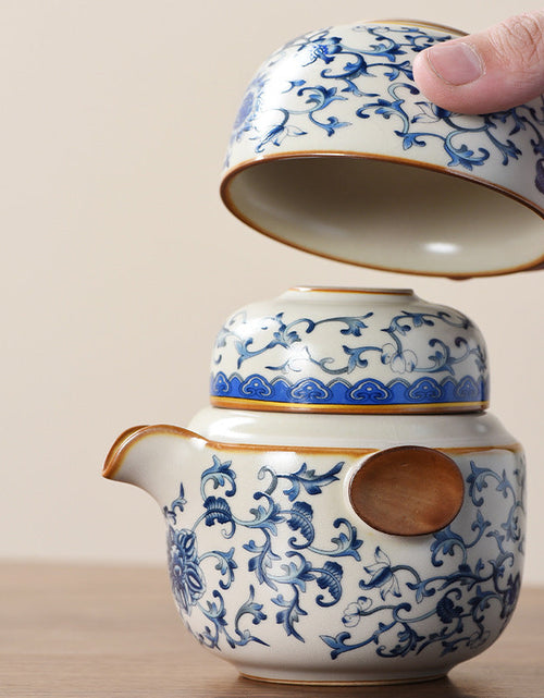 Load image into Gallery viewer, Blue and white beige Ru kiln travel tea set one pot three cups outdoor portable entwined lotus ceramic retro teapot
