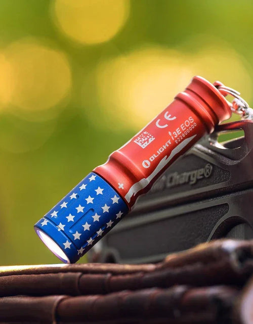 Load image into Gallery viewer, OLIGHT I3ESTARSSTRIPES i3E EOS Keychain Flashlight - Stars &amp; Stripes Edition
