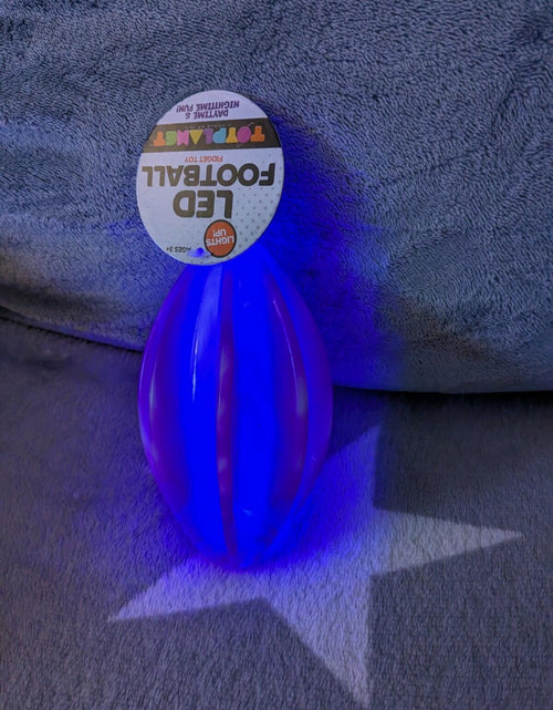 Load image into Gallery viewer, LED Football Toy Planet Fidget Toy Purple Swirl 6" x 3.25"
