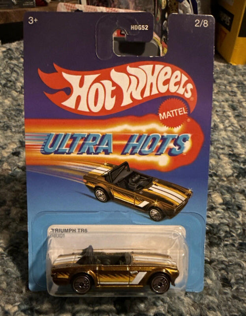 Load image into Gallery viewer, Hot Wheels Ultra Hots Triumph TR6 Copper White 1:64 Diecast Car 2024
