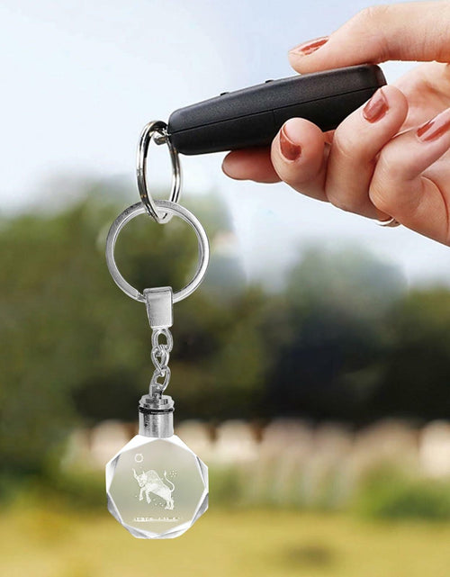 Load image into Gallery viewer, Artmosphere Taurus Zodiac Crystal LED Keychain Color Changing Transparent
