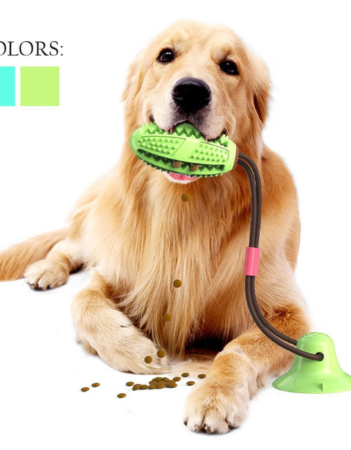 Load image into Gallery viewer, Pet Life ® 'Grip N' Play' Treat Dispensing Football Shaped Suction Cup Dog Toy
