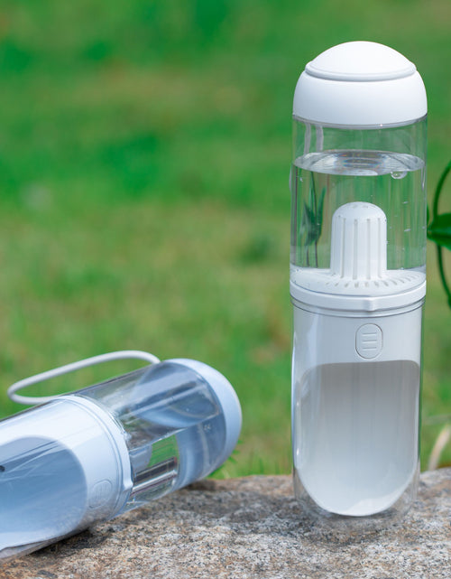Load image into Gallery viewer, Pet Life ® 'PYURE' Handheld Travel Filtered Water Feeder
